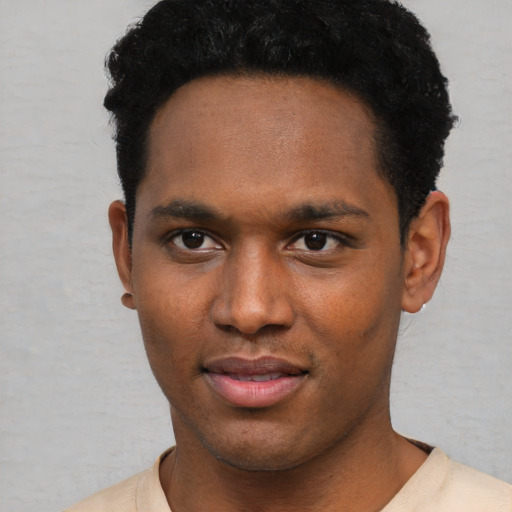 Neutral black young-adult male with short  black hair and brown eyes