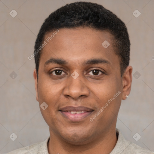 Joyful black young-adult male with short  black hair and brown eyes