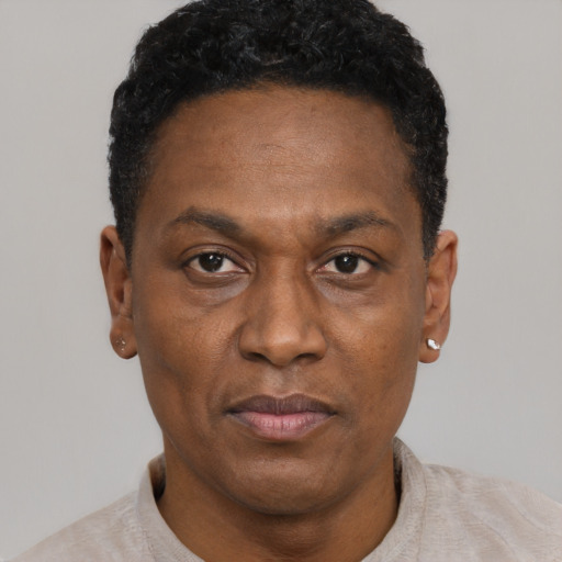 Neutral black adult male with short  black hair and brown eyes
