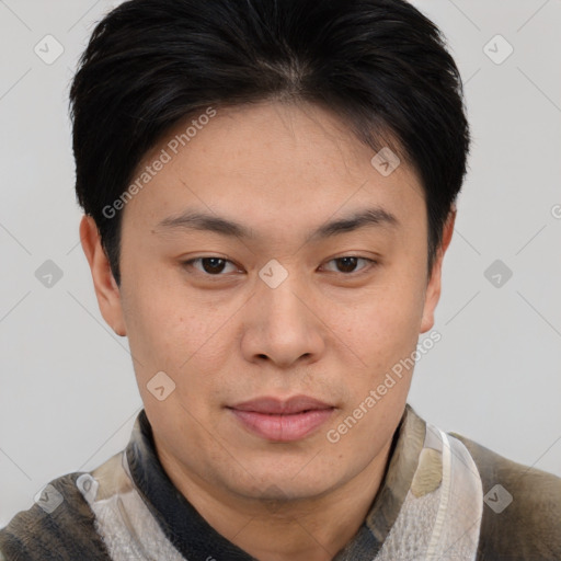 Joyful asian young-adult male with short  brown hair and brown eyes