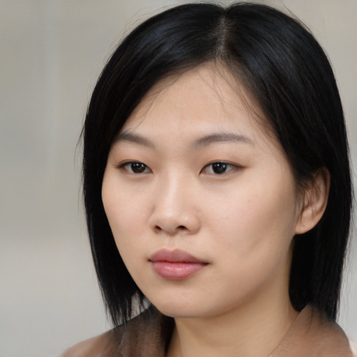 Neutral asian young-adult female with medium  black hair and brown eyes