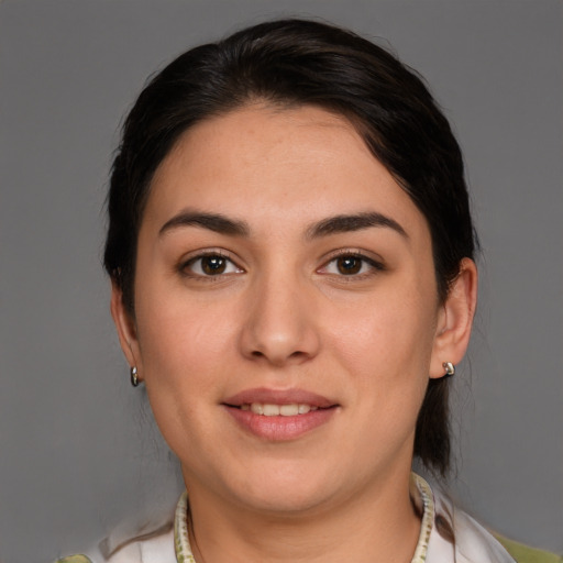 Joyful white young-adult female with medium  brown hair and brown eyes