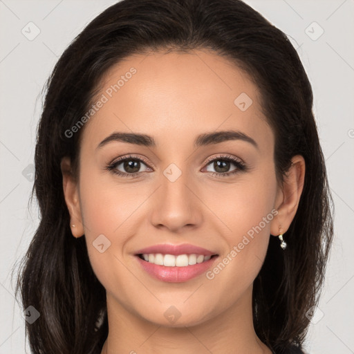 Joyful white young-adult female with long  brown hair and brown eyes