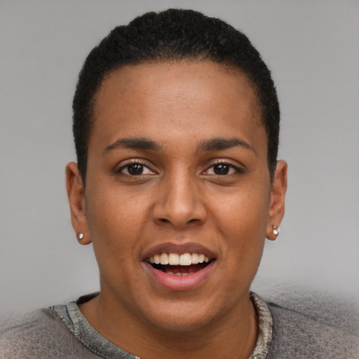 Joyful black young-adult male with short  brown hair and brown eyes