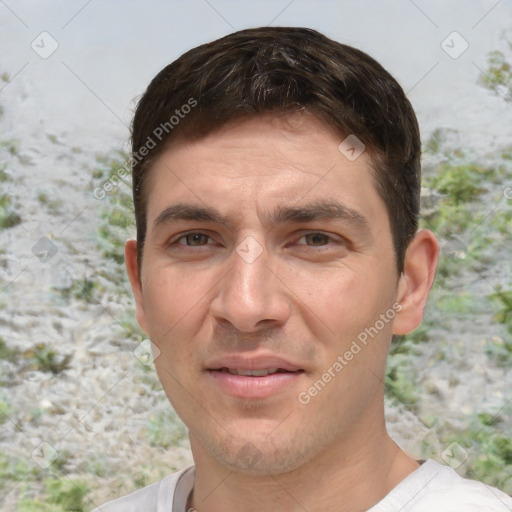 Joyful white young-adult male with short  brown hair and brown eyes