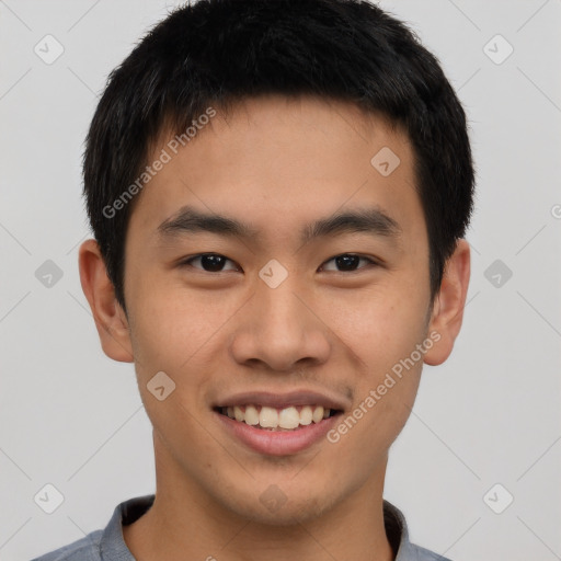 Joyful asian young-adult male with short  black hair and brown eyes