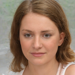 Joyful white young-adult female with medium  brown hair and blue eyes