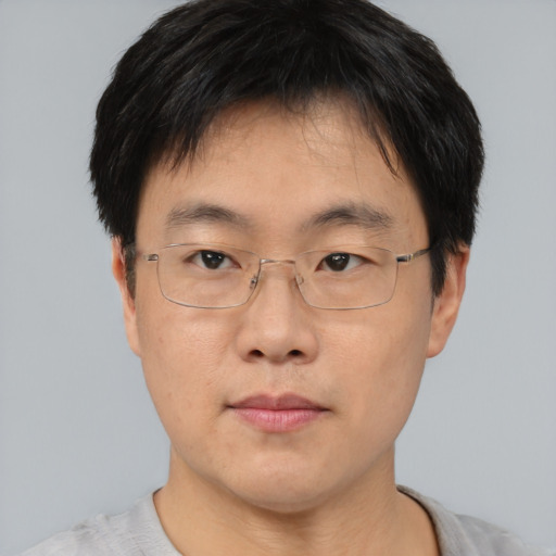 Neutral asian adult male with short  brown hair and brown eyes