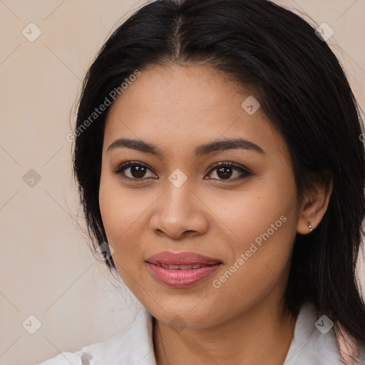 Joyful latino young-adult female with medium  brown hair and brown eyes