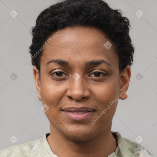 Joyful black young-adult female with short  black hair and brown eyes