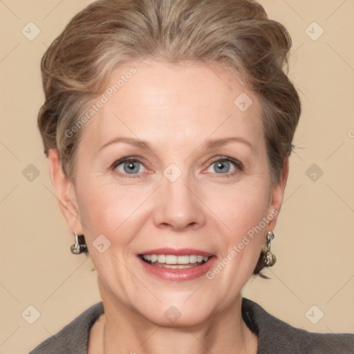 Joyful white adult female with medium  brown hair and grey eyes