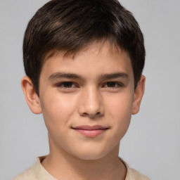 Joyful white child male with short  brown hair and brown eyes