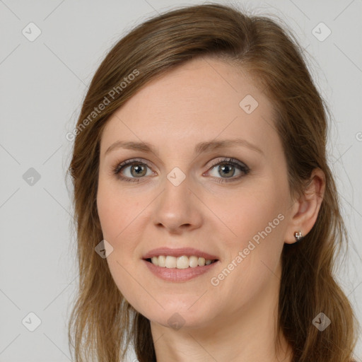 Joyful white young-adult female with long  brown hair and grey eyes