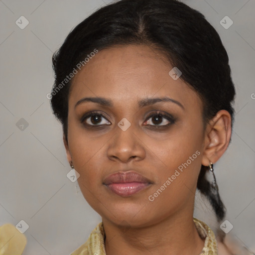 Joyful black young-adult female with medium  brown hair and brown eyes