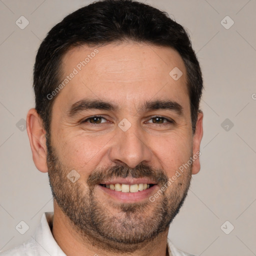 Joyful white adult male with short  brown hair and brown eyes