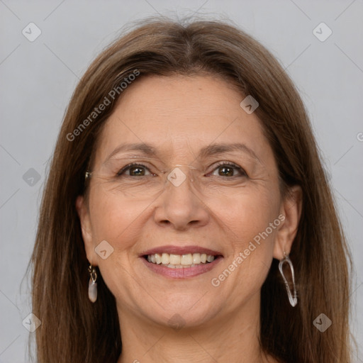 Joyful white adult female with long  brown hair and grey eyes