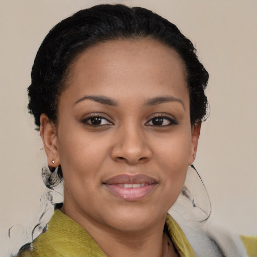 Joyful black young-adult female with short  brown hair and brown eyes