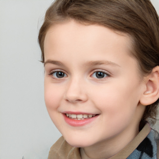 Joyful white child female with medium  brown hair and brown eyes