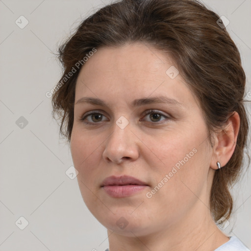 Joyful white adult female with medium  brown hair and grey eyes