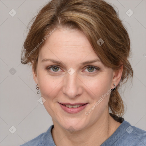 Joyful white adult female with medium  brown hair and blue eyes