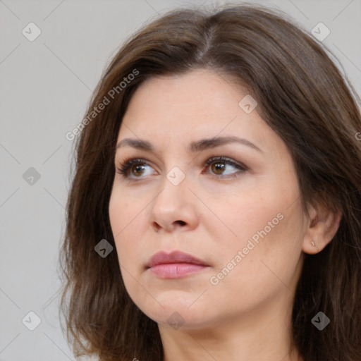 Neutral white young-adult female with long  brown hair and brown eyes