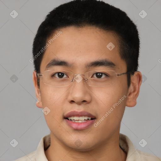 Joyful asian young-adult male with short  brown hair and brown eyes