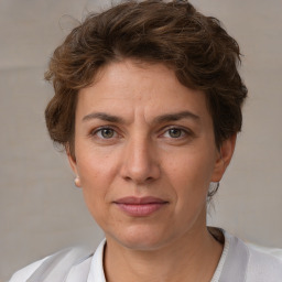 Joyful white adult female with short  brown hair and brown eyes