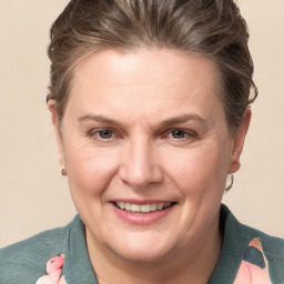 Joyful white adult female with short  brown hair and grey eyes