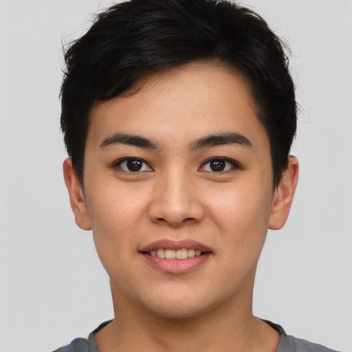 Joyful asian young-adult male with short  brown hair and brown eyes