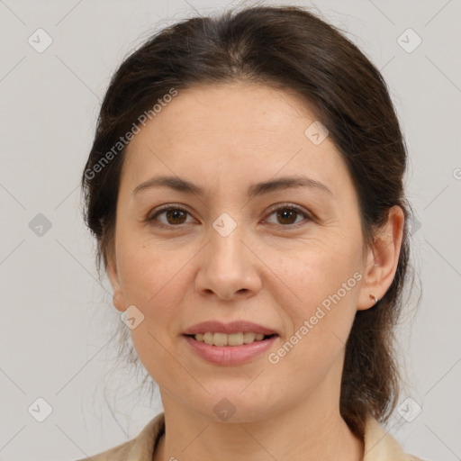 Joyful white adult female with medium  brown hair and brown eyes