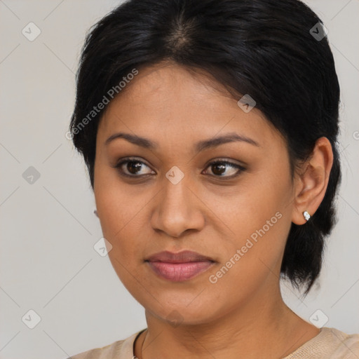 Joyful latino young-adult female with medium  brown hair and brown eyes