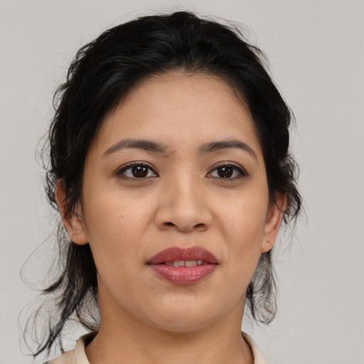 Joyful asian young-adult female with medium  brown hair and brown eyes