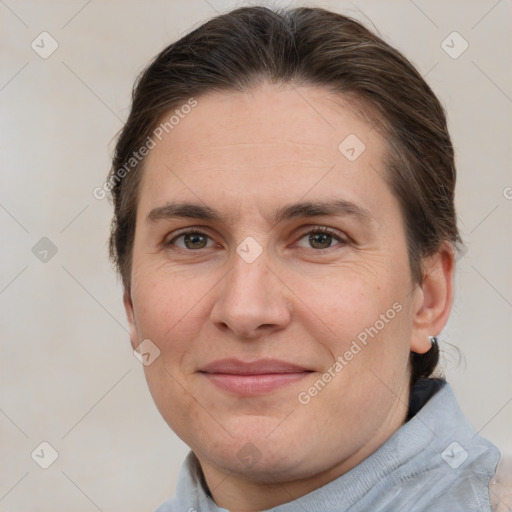 Joyful white adult female with short  brown hair and grey eyes