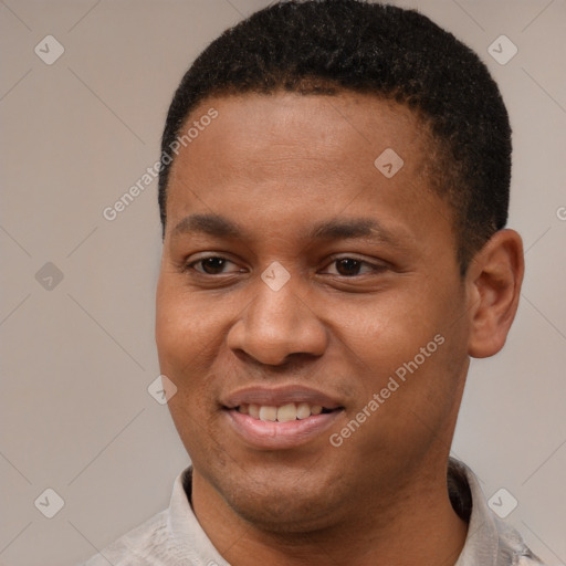 Joyful latino young-adult male with short  brown hair and brown eyes