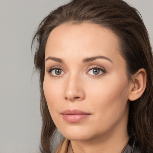 Neutral white young-adult female with long  brown hair and brown eyes