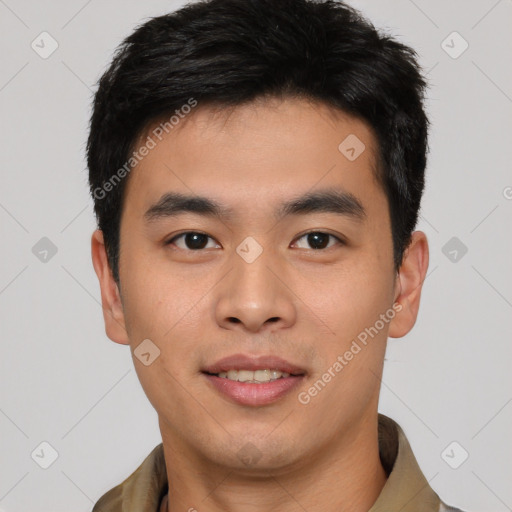 Joyful asian young-adult male with short  black hair and brown eyes