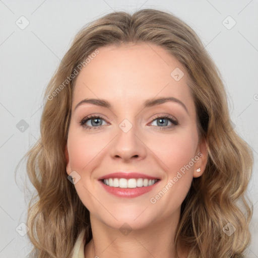 Joyful white young-adult female with long  brown hair and green eyes