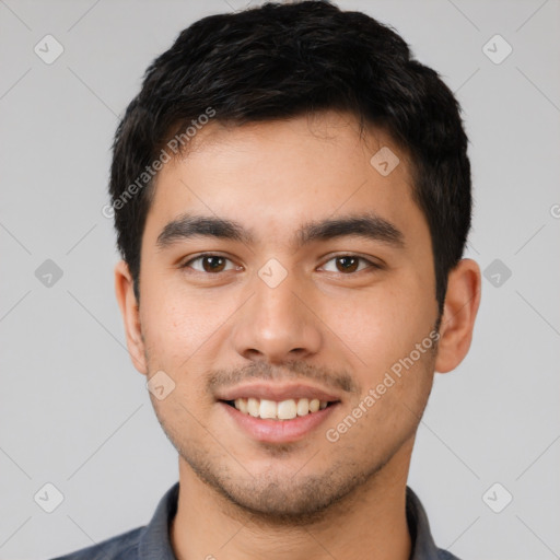 Joyful white young-adult male with short  black hair and brown eyes