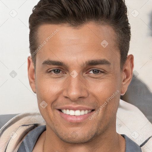 Joyful white young-adult male with short  brown hair and brown eyes