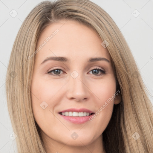 Joyful white young-adult female with long  brown hair and brown eyes