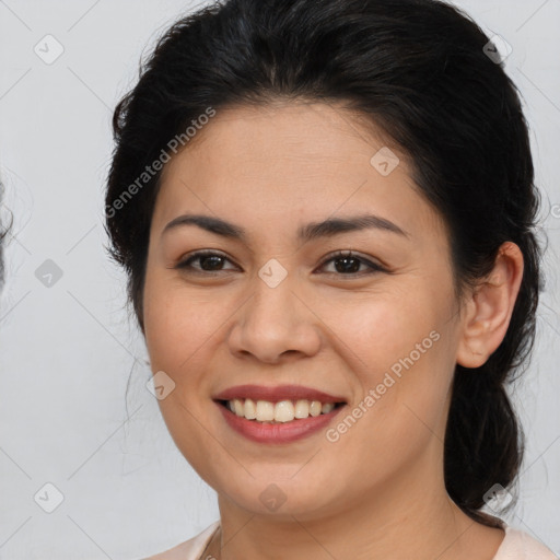 Joyful latino young-adult female with medium  brown hair and brown eyes