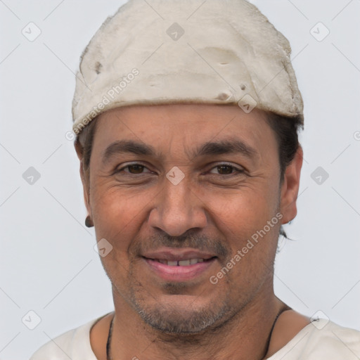 Joyful white adult male with short  black hair and brown eyes