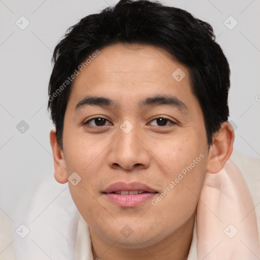 Joyful asian young-adult male with short  brown hair and brown eyes