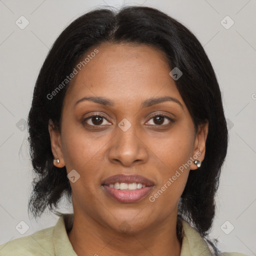 Joyful black adult female with medium  brown hair and brown eyes