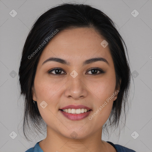 Joyful asian young-adult female with medium  black hair and brown eyes