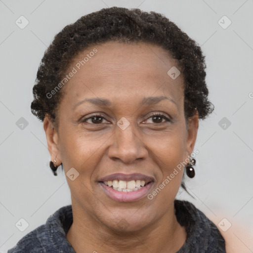 Joyful black adult female with short  brown hair and brown eyes