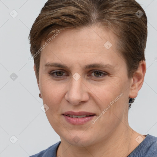 Joyful white adult female with short  brown hair and grey eyes