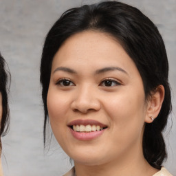 Joyful asian young-adult female with medium  black hair and brown eyes