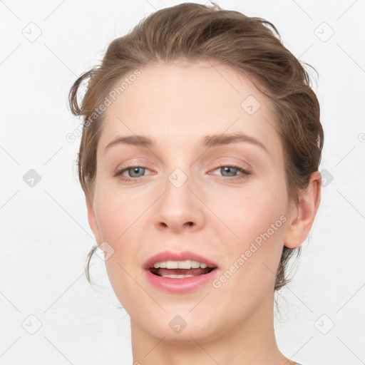 Joyful white young-adult female with medium  brown hair and blue eyes