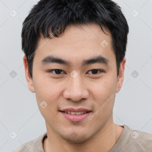 Joyful asian young-adult male with short  brown hair and brown eyes